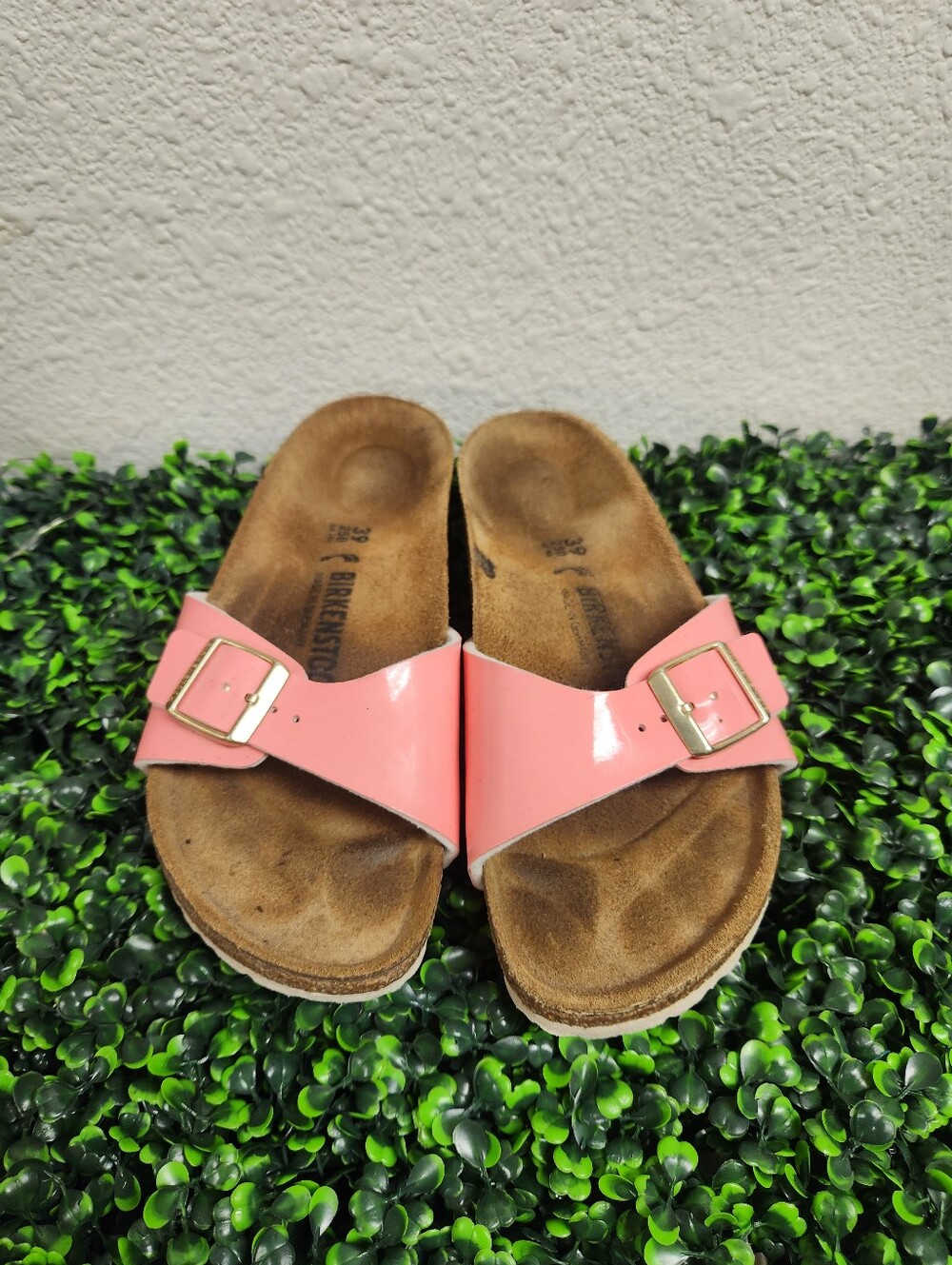 Birkenstock Madrid sandals in a coral peach patent finish